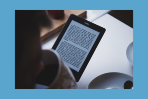 person reading book on Kindle