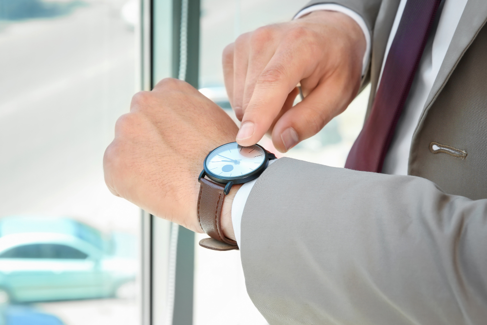 man looking at his watch